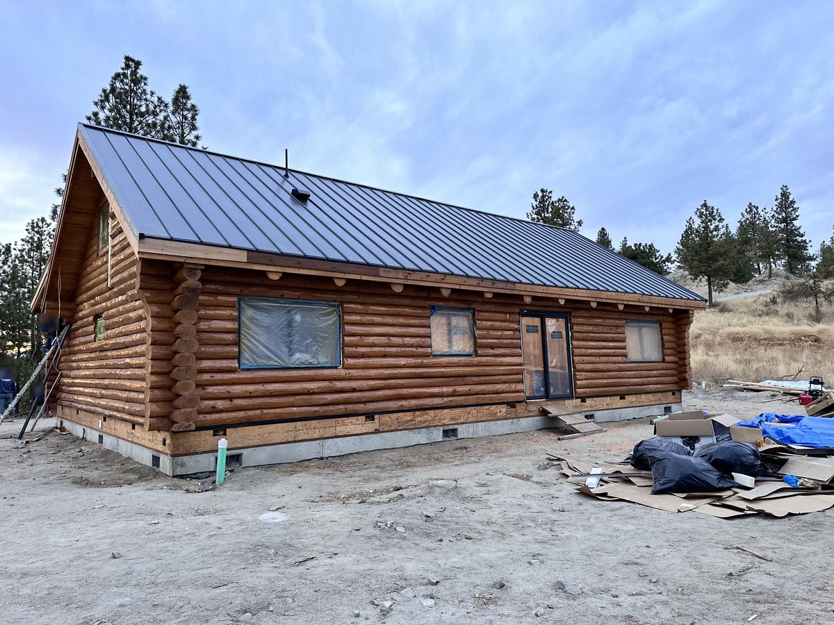 Our log home in the hills above Chelan with its new metal roof